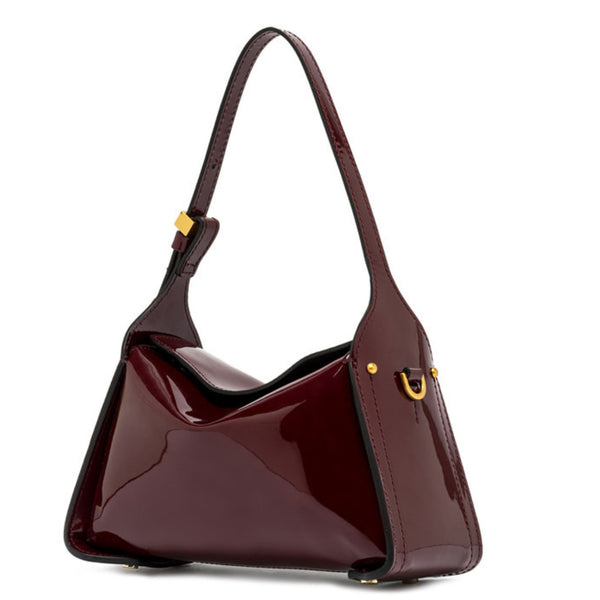 Dark berry patent-leather shoulder handbag with curved handles, side detail, and gold hardware