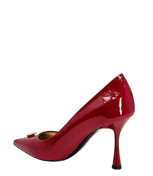 Red patent pointed-toe pump with stiletto heel, angled side view