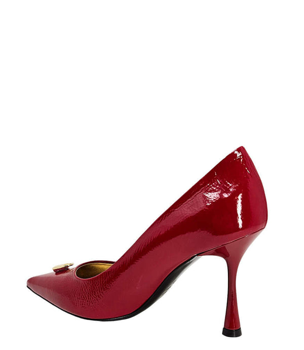 Red patent pointed-toe pump with stiletto heel, angled side view