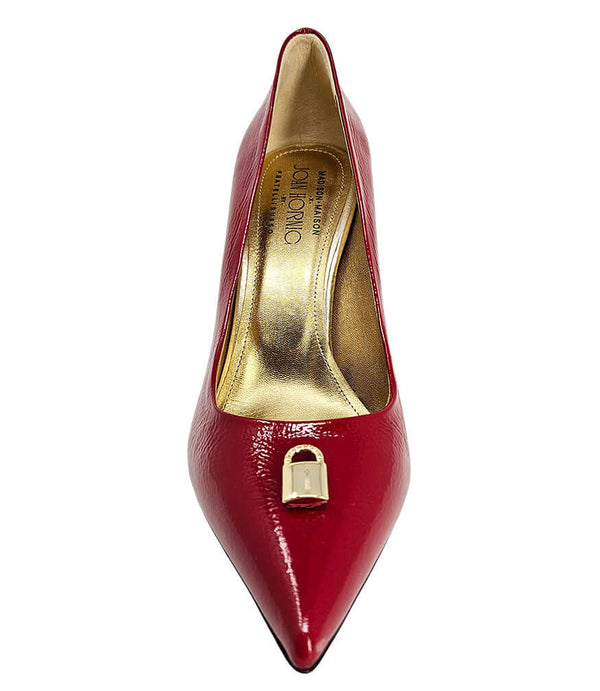Red patent pointed-toe pump with stiletto heel and gold lock buckle detail