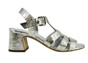 Silver metallic gladiator heel sandal with wide straps and block heel, buckle