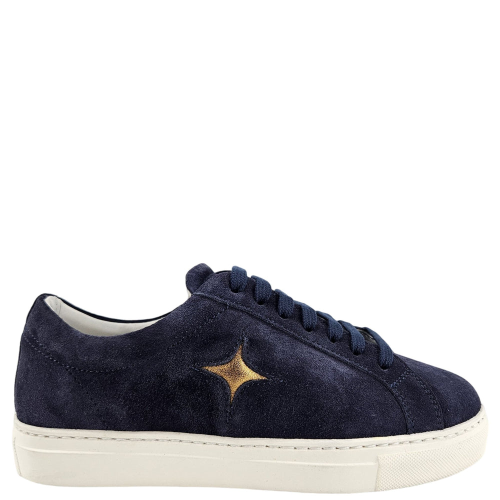 Navy suede womens sneaker with lace-up front and gold star logo, white rubber sole.