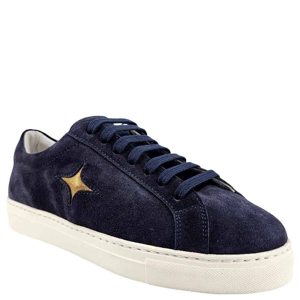 Navy suede womens sneaker with lace-up front and gold star logo, white rubber sole.