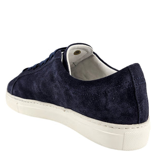 Navy suede womens sneaker with lace-up front, padded collar, and white rubber sole.