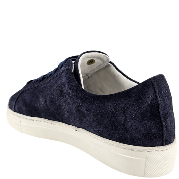 Navy suede womens sneaker with lace-up front, padded collar, and white rubber sole.