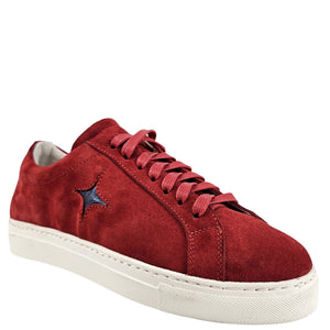 Red suede lace-up sneaker, side view with blue star emblem and white rubber sole