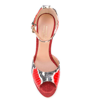 Red glitter platform peep-toe heel with cow-print straps and ankle buckle