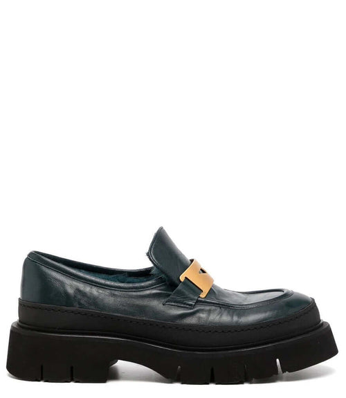 Dark navy leather chunky loafer with shearling lining and gold buckle strap