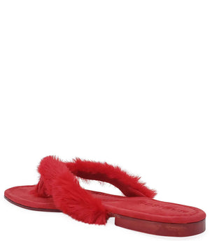 Red thong sandal with cross-over faux-fur strap and flat rubber sole
