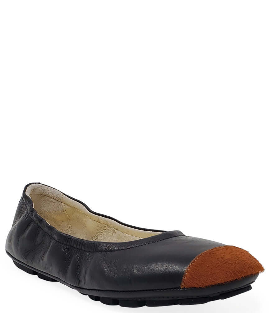 Black ballet flat with tan calf-hair toe and low rubber sole
