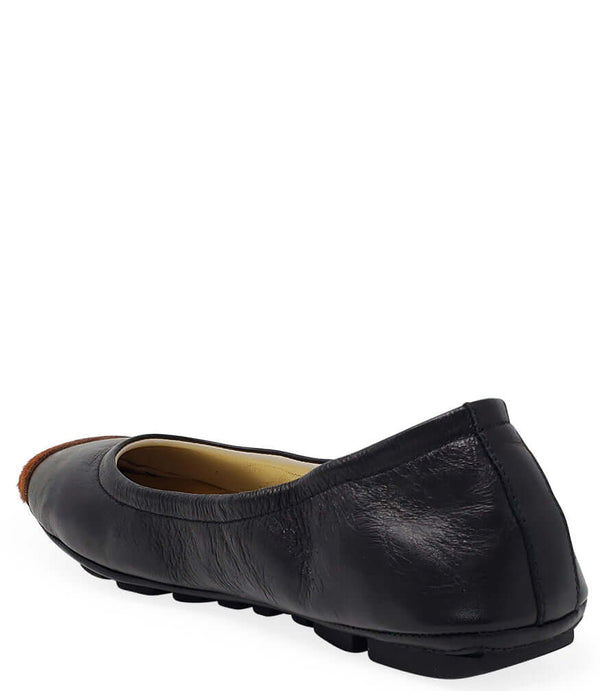 Black leather ballet flat with tan calf-hair toe tip, side view