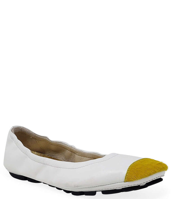 White ballet flat with yellow calf-hair toe tip and black tread sole