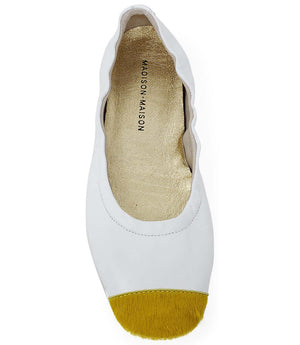 White ballet flat insole view with yellow calf-hair toe trim