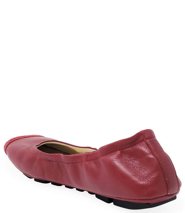Red ballet flat with cushioned heel collar and textured sole, slip-on