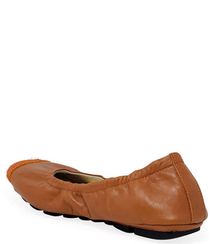 Tan-brown leather ballet flat heel view with orange calf-hair toe tip and black sole