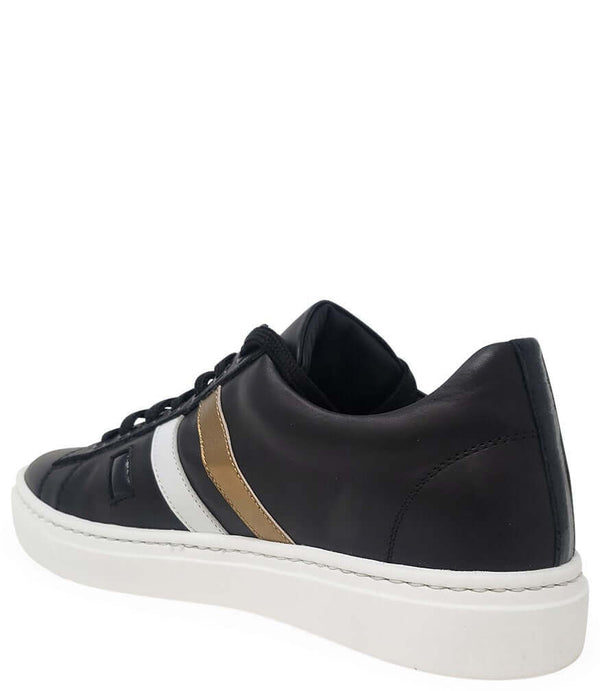 Black leather low-top sneaker, side view with gold and white stripes, white rubber sole