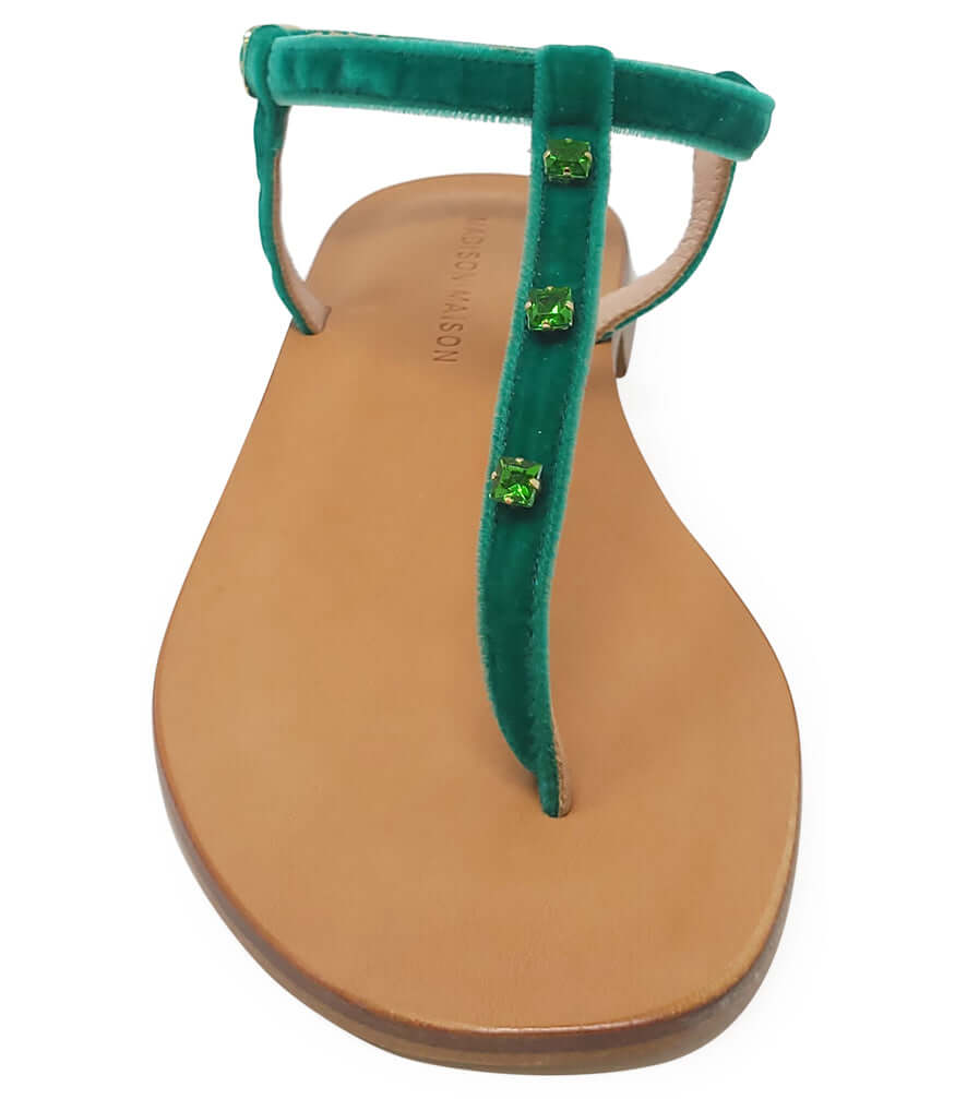 Emerald green jeweled thong sandal with T-strap and flat tan sole