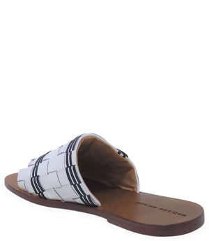 Open-toe slide sandal showing footbed and striped woven upper, white with black