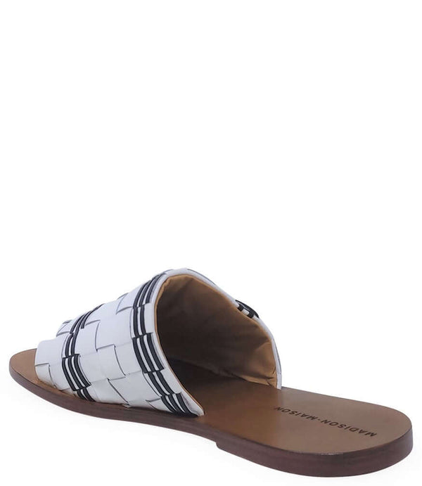 Open-toe slide sandal showing footbed and striped woven upper, white with black