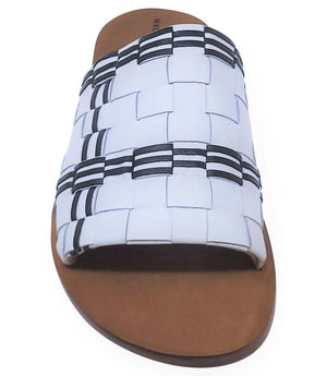 Open-toe sandal close-up of white woven patchwork straps with black stripes