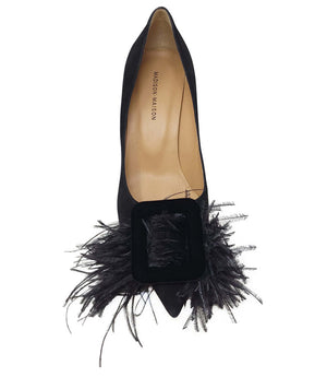 Black suede heel pump with open vamp and black feather embellishment at front