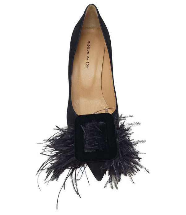 Black suede heel pump with open vamp and black feather embellishment at front