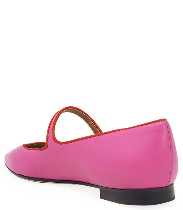 Pink leather pointy-toe ballet flats showing heel and U-shaped back opening