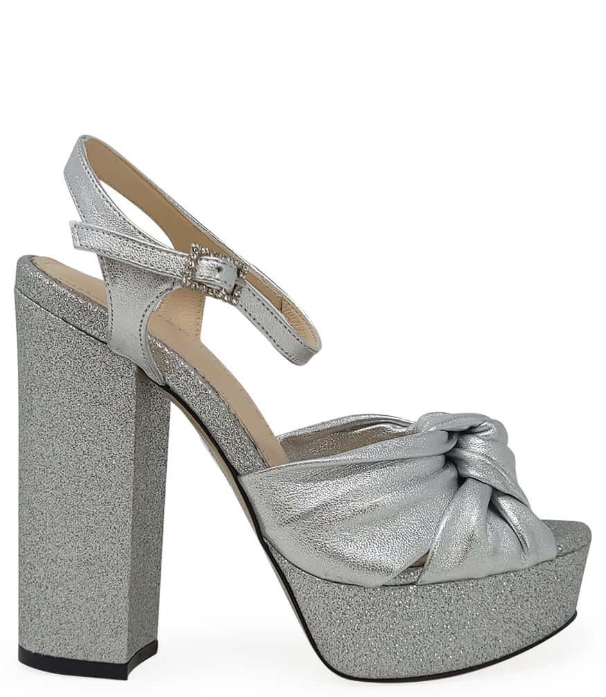 Silver glitter platform heel sandal with ankle strap and twisted bow