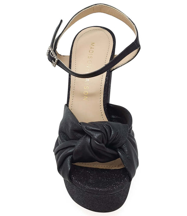 Black platform heel sandal with ankle strap and knot bow front, glitter finish