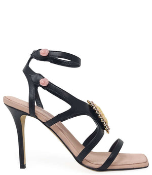 Black leather high-heel sandal with pink cameo detail and thin ankle straps