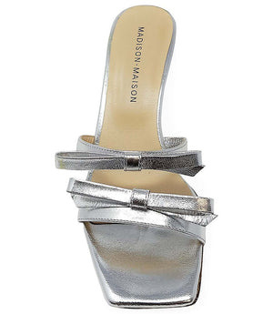 Silver mule-style high-heel sandal with layered straps and square buckles