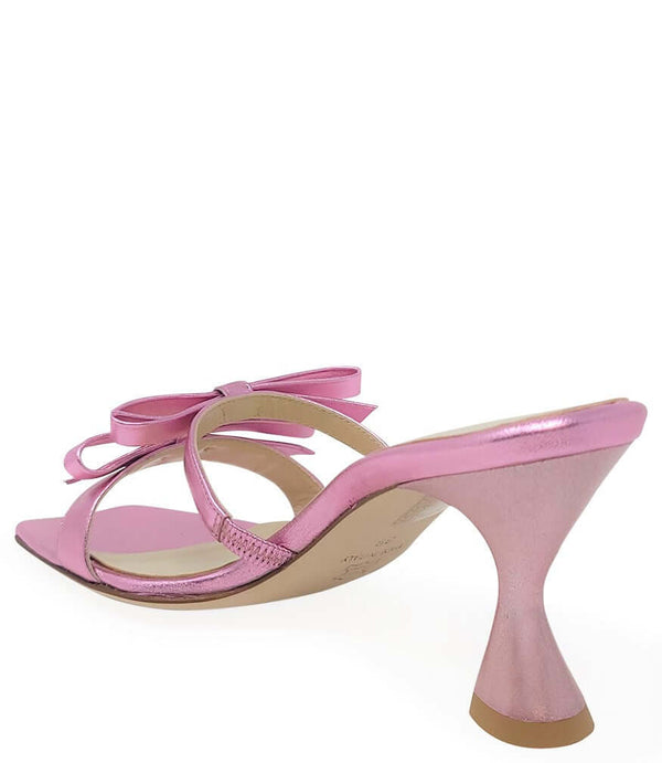 Pink high heel sandal with open back, bow tie detail, metallic finish
