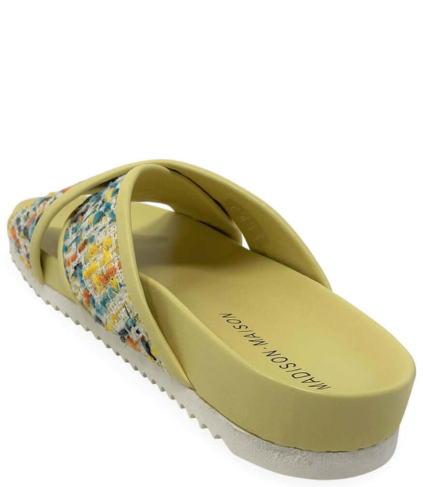 Toe view yellow cross strap sandal with multicolor woven upper and rubber sole