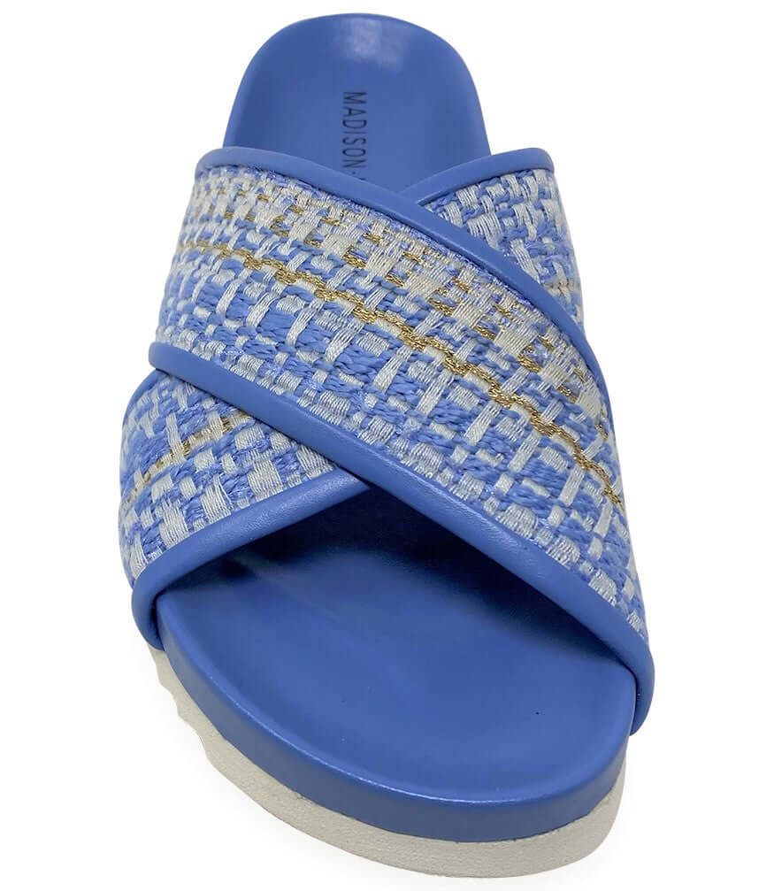 Sky blue slide sandal with crisscross strap and woven textile upper; cushioned outsole