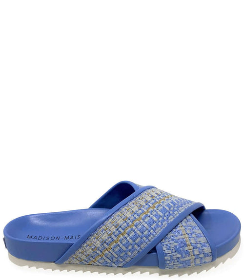 Sky blue slide sandal with crisscross strap and woven textile upper; cushioned outsole