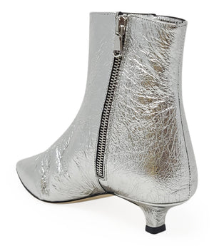 Silver metallic ankle boot with visible side zipper and pointed toe, kitten heel