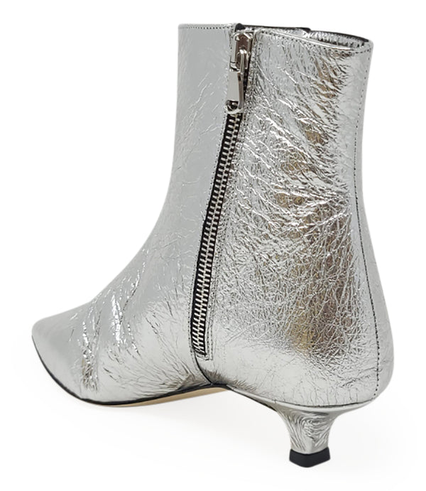 Silver metallic ankle boot with visible side zipper and pointed toe, kitten heel