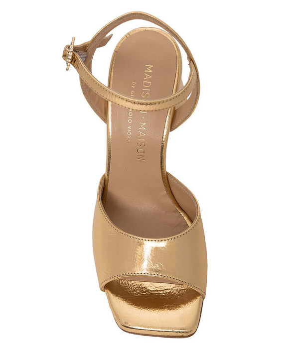 Gold metallic leather square-toe heels with ankle strap and jeweled side buckle